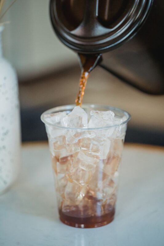 Caffeine before the gym: dose, timing and sleep | the gym pro Coffee Being Poured Over Ice