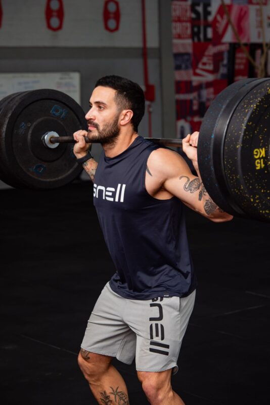 Upper lower split: a 4-day workout with progression | the gym pro Man Holding A Barbell Across His Upper Back