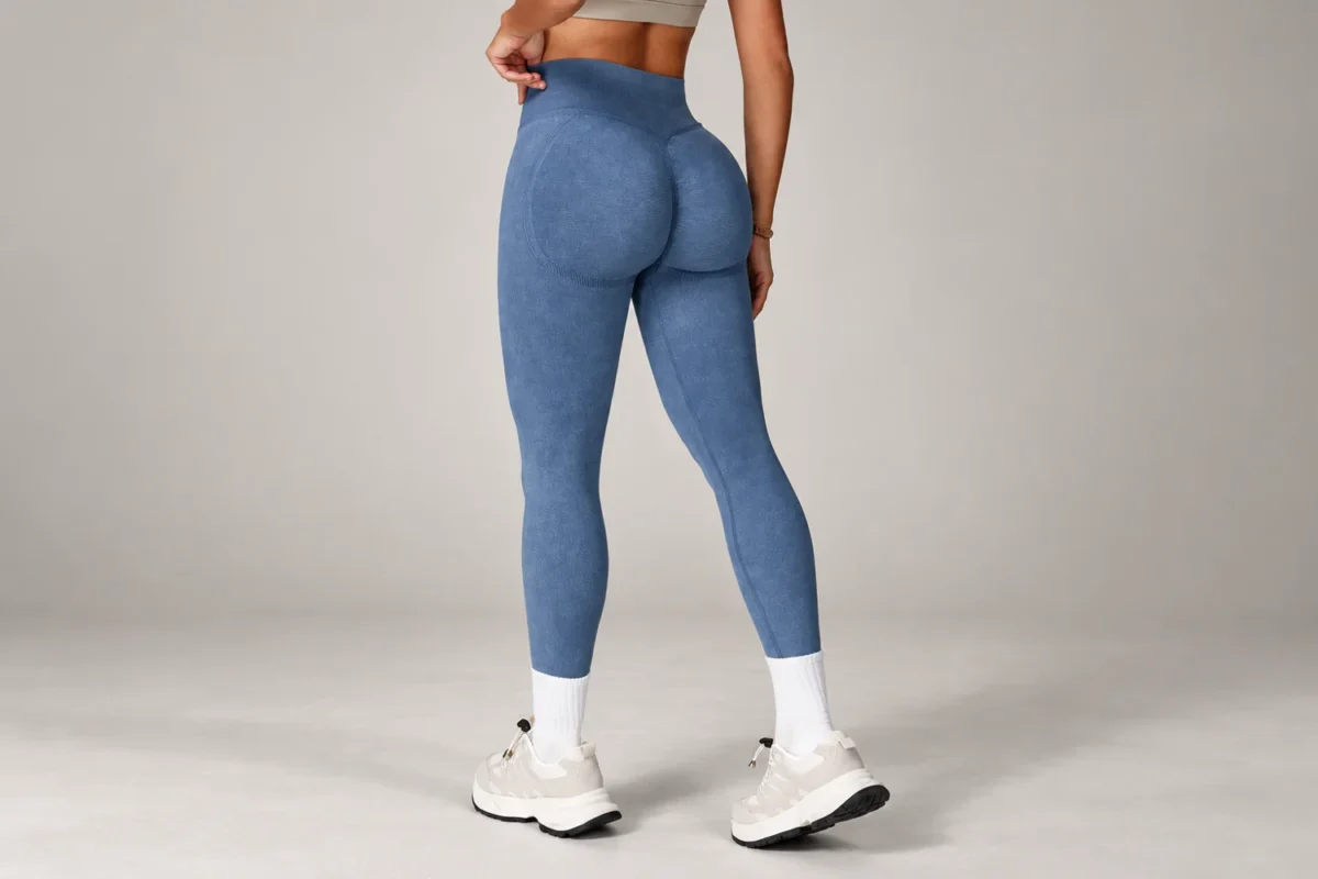 How to choose gym leggings for squats and training | the gym pro Edited Studio Photo Of A Model Wearing Slate Blue High-Waisted Gym Leggings And White Trainers